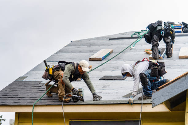 Professional Gutter Installation technician working in Cove, OR
